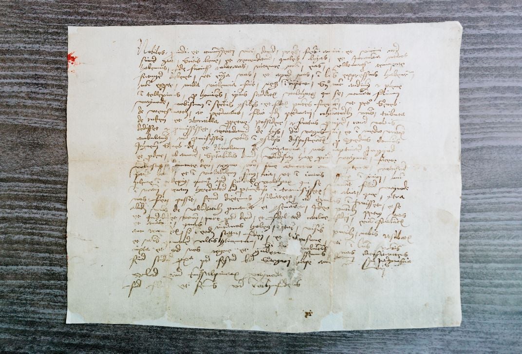 a letter with handwritten text shown from above