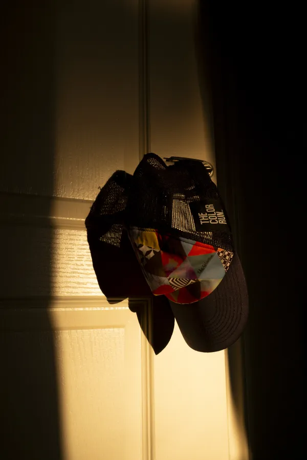 Hat Hanging on a Doorknob in Sunlight thumbnail