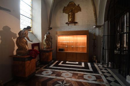 Robbers rammed their car into the medieval cathedral, sawing through metal bars to grab silver chalices and other irreplaceable church treasures.