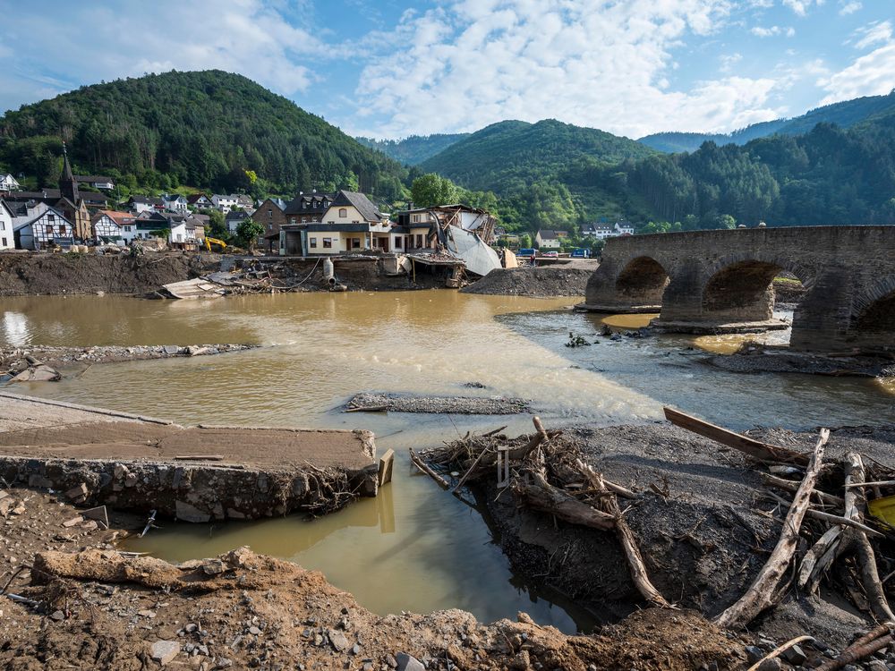 Destroyed houses, roads and a bridge pictured during ongoing cleanup efforts in the Ahr Valley region following catastrophic flash floods on August 04, 2021 in Rech, Germany.