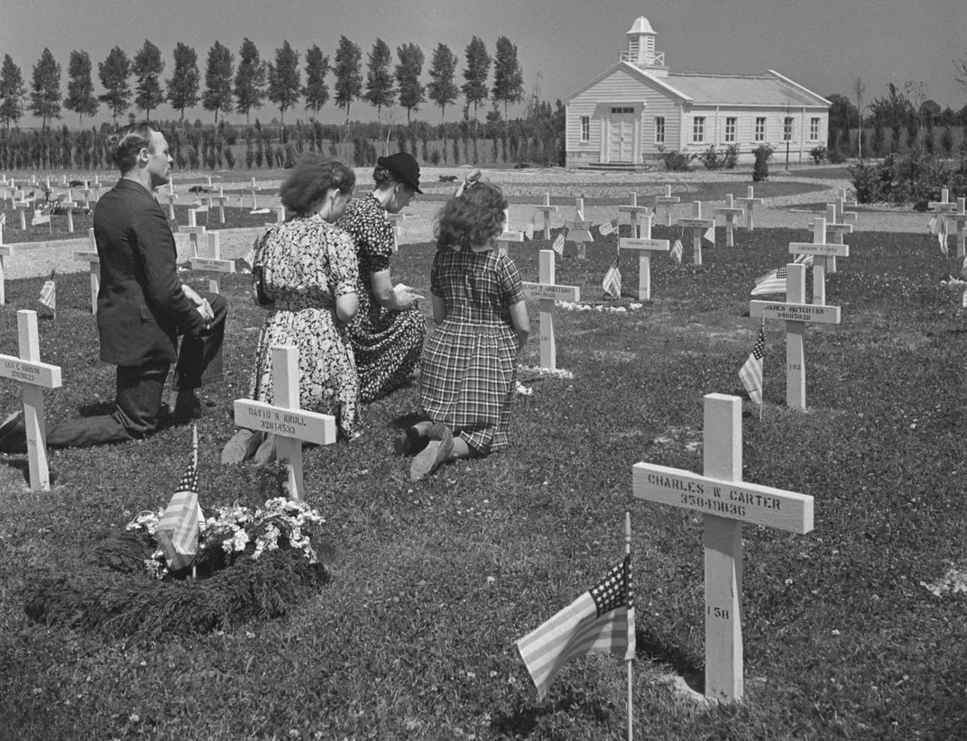 A 1947 photo of Margraten residents honoring the fallen American troops buried near their town
