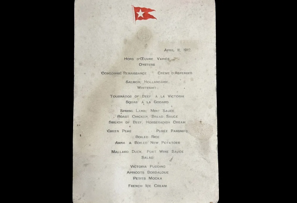 Piece of white paper with smudges and a red flag at the top