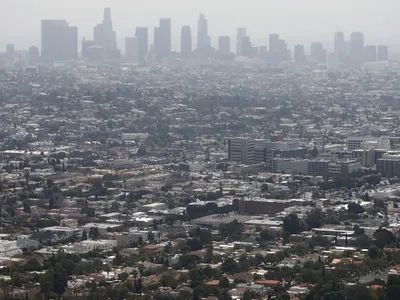 Smog hangs over downtown Los Angeles, here in 2019.&nbsp;A new study found links between&nbsp;heavy&nbsp;air pollution and historical redlining in urban areas.