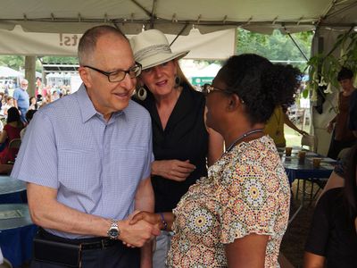 Smithsonian Secretary David Skorton and his wife, Robin Davisson, greet Marie Dieng at the Institution's staff picnic on the National Mall. Skorton begins his tenure as the 13th Secretary on July 1. 
