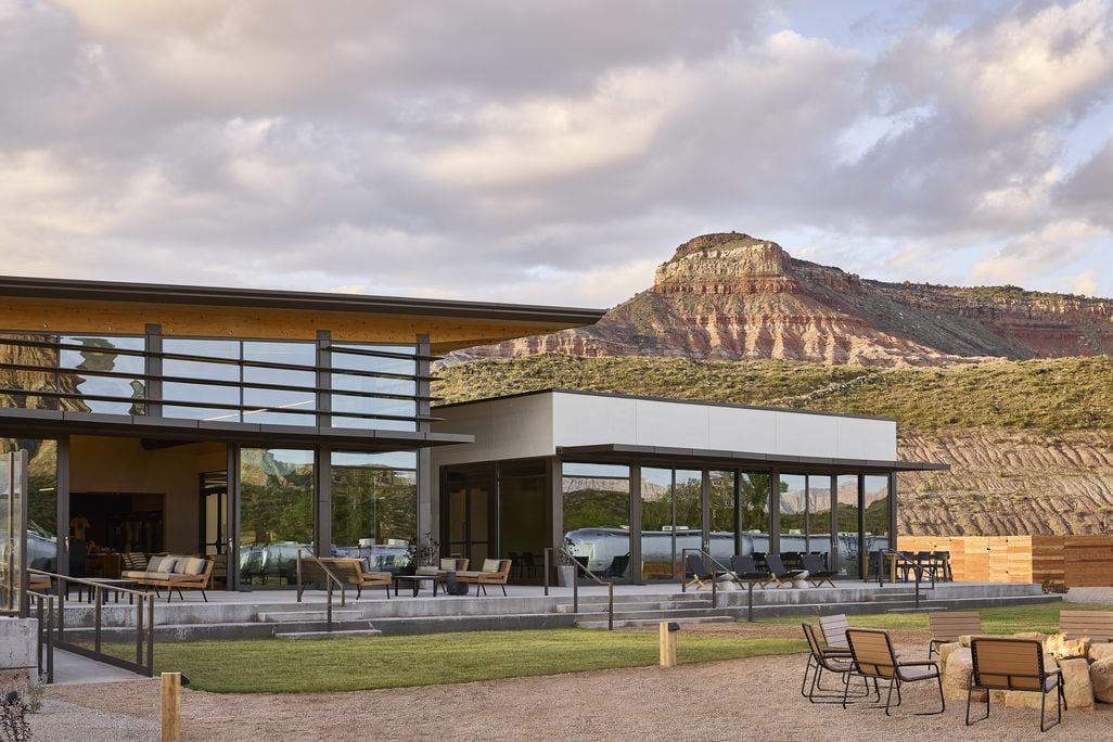 Glamping resort clubhouse with sandstone rock formation behind