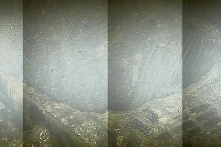 The hole in the grate below the pressure vessel in reactor 2, possibly caused by melted nuclear material