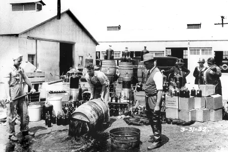 Orange County Sheriff's Department disposing of illegal alcohol, circa 1932. 