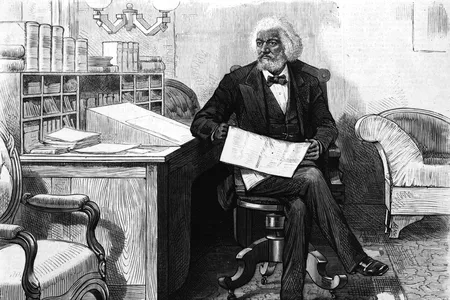 American orator, editor, author, abolitionist and former slave Frederick Douglass (1818-1895) edits a journal at his desk, late 1870s.
