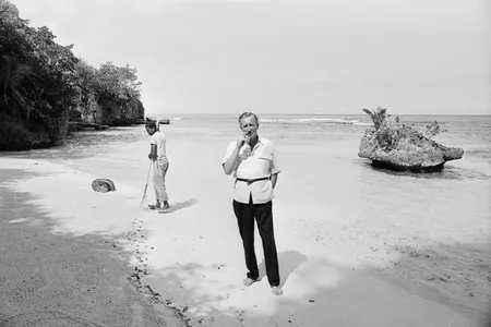 British novelist Ian Fleming on the beach near Goldeneye, his Jamaica home, on February 23, 1964