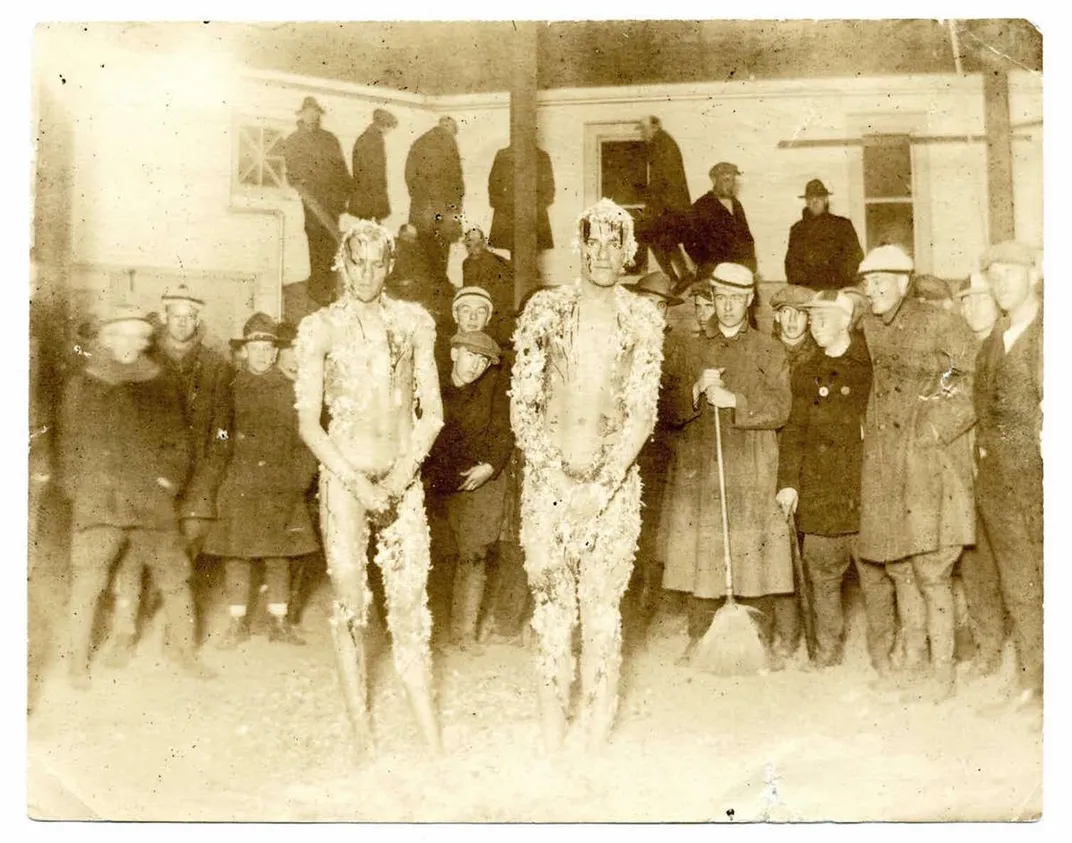 The Courtney brothers, pictured tarred and feathered inside the livestock-viewing pavilion on the University of Maine’s campus