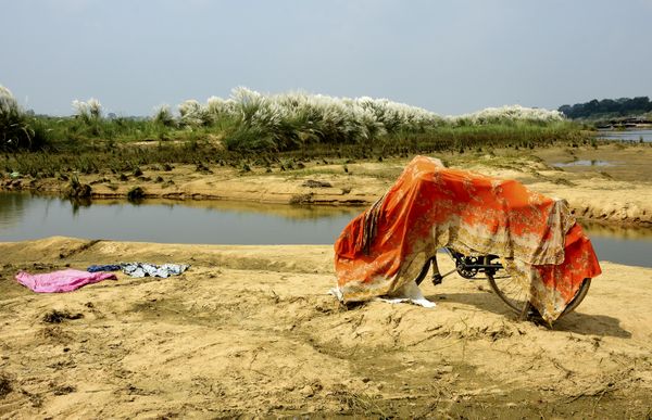 A colorful landscape with a drying saree on a cycle. thumbnail