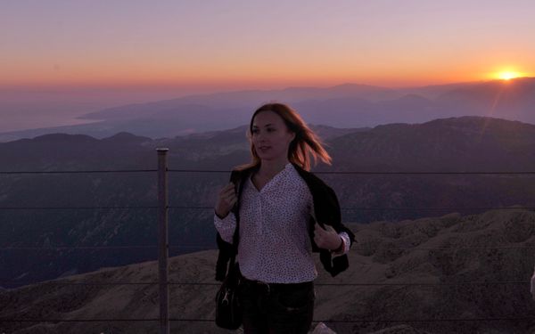Beautiful sunset by beautiful woman thumbnail
