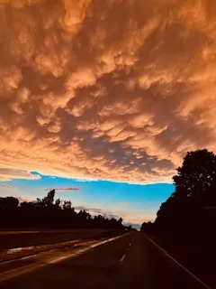 A blazing sunset on a empty road thumbnail