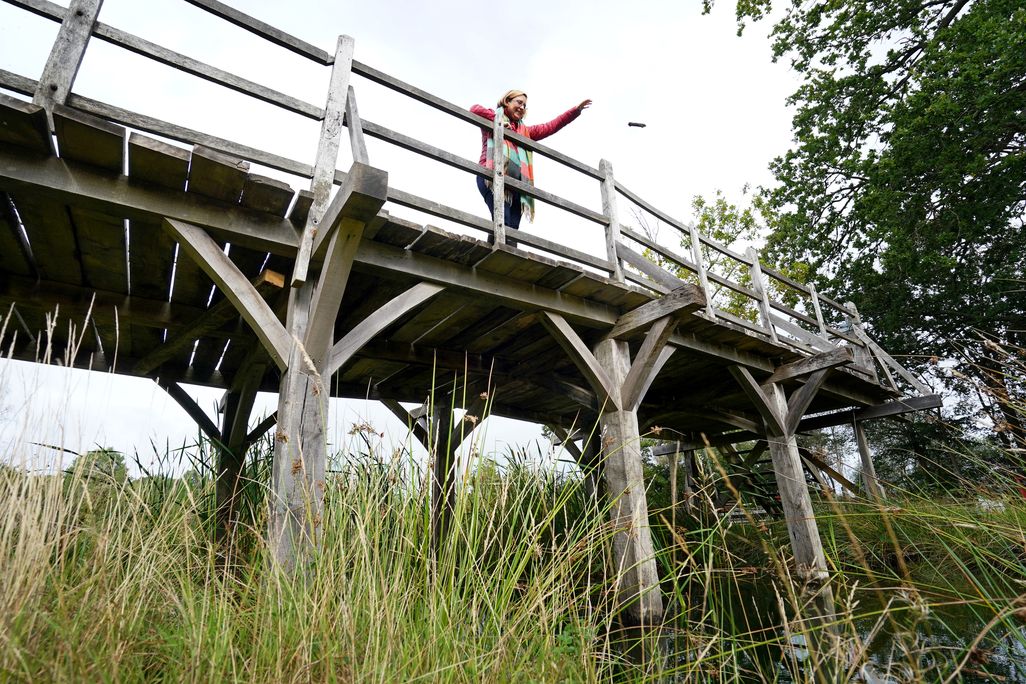 Silke Lohmann of Summers Place Auctions stands on the original Poohsticks Bridge from Ashdown Forest,