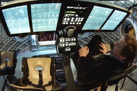 Musk showing off the interior of his new vehicle.