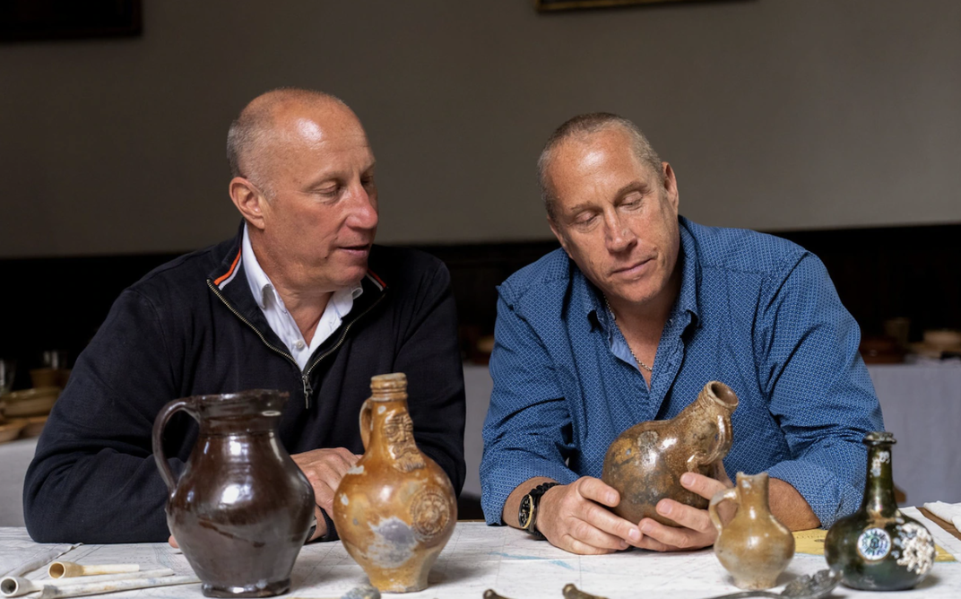 Julian and Lincoln Barnwell with artifacts recovered from the wreck of the H.M.S. Gloucester