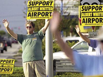 In 2003, Steve Lange (left) chaired a sign-waving group that met each Friday at a different intersection in the city.