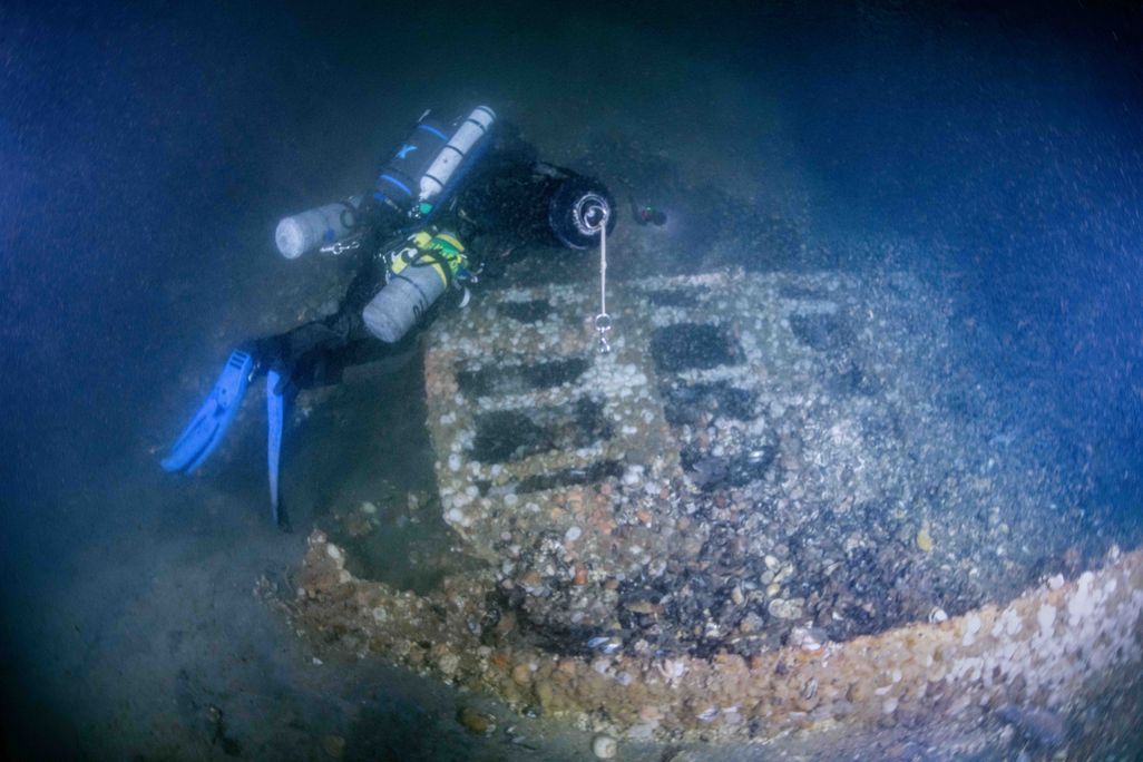 Diver over top of shipwreck