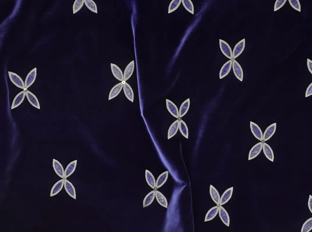 Blue fabric with designs on it