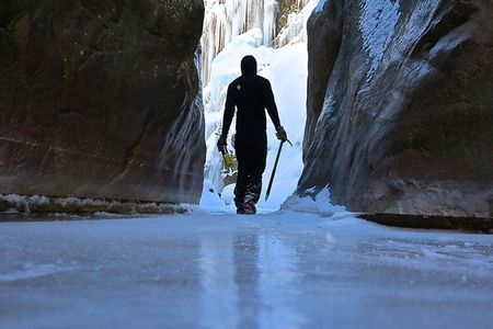 The steep walls of the Uncompahgre Gorge dwarf a climber after a long day on the cliffs.