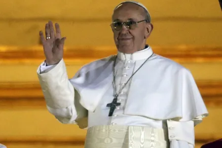 Pope Francis waves to the crowd from the central balcony of St. Peter’s Basilica at the Vatican, Wednesday, March 13, 2013. Cardinal Jorge Bergoglio who chose the name of Francis is the 266th pontiff of the Roman Catholic Church.