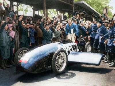 Fritz von Opel celebrates a run in his RAK-2 rocket car in Berlin on May 23, 1928. He had the original black-and-white image colorized.