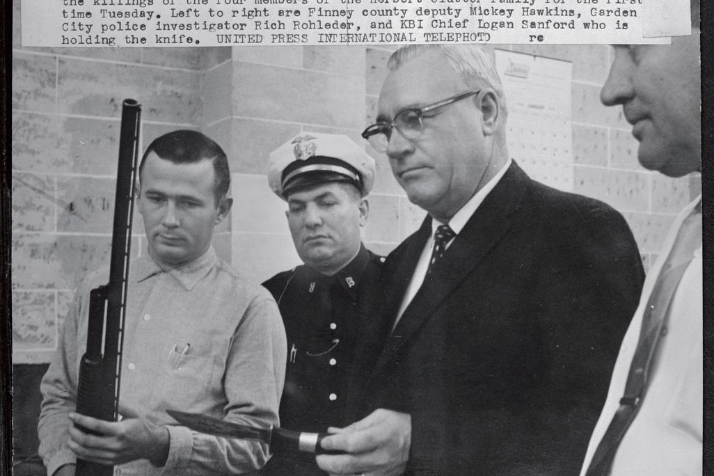 Officers display shotgun and knife used in the killings of the four members of the Herbert Clutter family