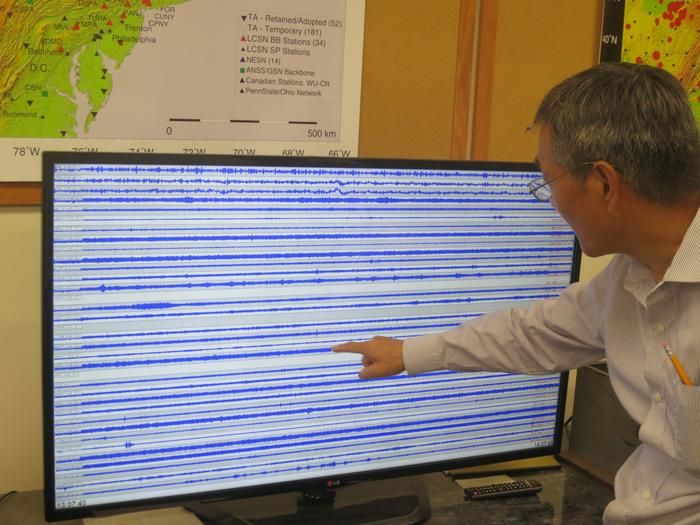 Seismologist Won-Young Kim looks at a computer
