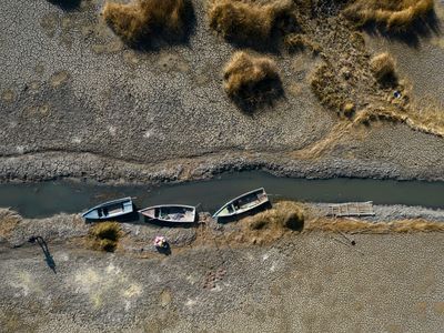Boats got stuck on Lake Titicaca&#39;s dried bed in September in Huarina, Bolivia, due to drought.