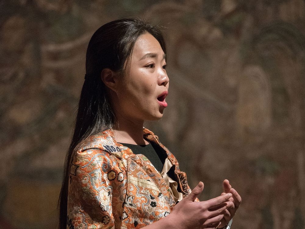 Sonic Blossom /2013–present / Lee Mingwei / Ongoing participatory performance installation with chair, music stand, costume, and spontaneous song / Installation view at “Lee Mingwei: Sonic Blossom,” The Metropolitan Museum of Art, New York, 2015 /Photo: Anita Kan.