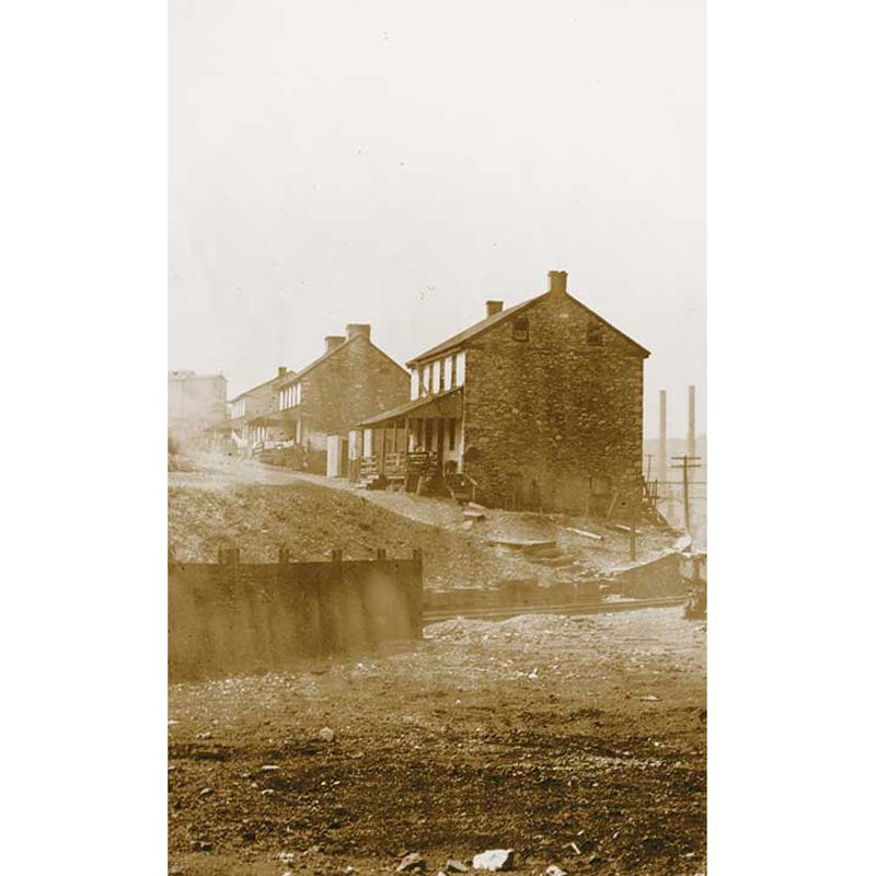 Sepia photo of company mill housing