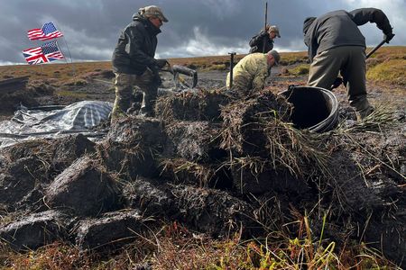 Archaeologists excavating near the crash site