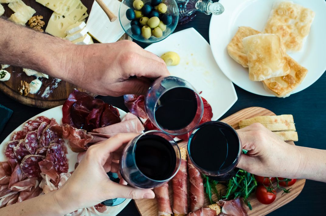 Enjoying wine and Italian charcuterie