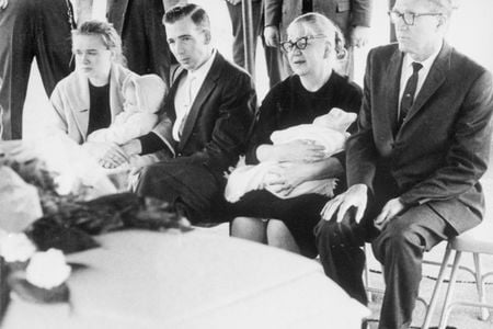 The Oswald family—with Marguerite Oswald second from right—sit next to Lee Harvey Oswald's casket.