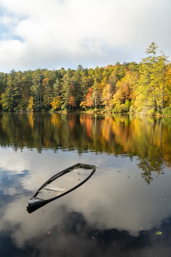 A boat, half submerged, after a storm. thumbnail