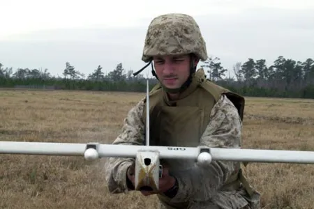 The miniature remote-controlled scout plane "helps alleviate the danger of what's over the hill," says aviation expert Ben Kristy.