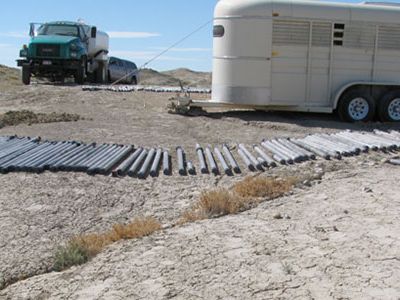 The products of our first day of coring. Drying in the hot Wyoming sun are segments of cores in their Lexan liners.