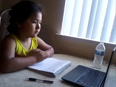 A Diné child begins her much-anticipated school year online in Albuquerque, New Mexico. (Courtesy of Cornillia Sandoval, used with permission)