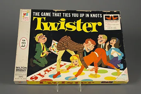 To deflect from concerns around sexual undertones, Milton Bradley packaged the game as inoffensively as possible.