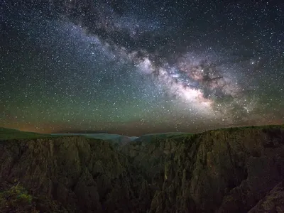 The Milky Way is visible at Black Canyon of the Gunnison National Park in western Colorado.