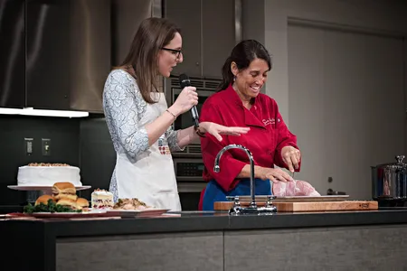 At the National Museum of American HIstory's demonstration kitchen, chefs like Chef Lynne Just of Sur La Table (above) prepare dishes, while food historian Ashley Rose Young engages them in conversations about the history and significance of the food and its traditions.