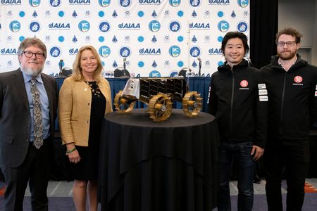 From left: Space History Curator Matt Shindell, National Air and Space Museum Director Ellen Stofan, iSpace Founder and CEO Takeshi Hakamada, and Chief Rover Engineer John Walker with the SORATO lunar rover at the Walter E. Washington Convention Center in Washington, D.C.