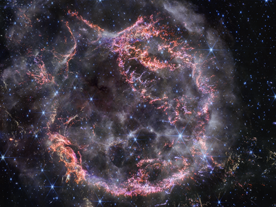 The supernova remnant Cassiopeia A, captured by NASA&#39;s James Webb Space Telescope in near-infrared light. The image shows the expanding material from the blast colliding with gas released by the star before the explosion.