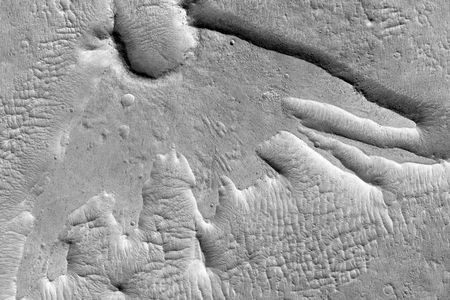 "Martian Thunderbird" is NASA's great name for this feature on Mars. Taken by the Mars Reconnaissance Orbiter, this image shows the result of "a low-angle impact from an asteroid or comet." 

Image: NASA/JPL-Caltech/Univ. of Arizona