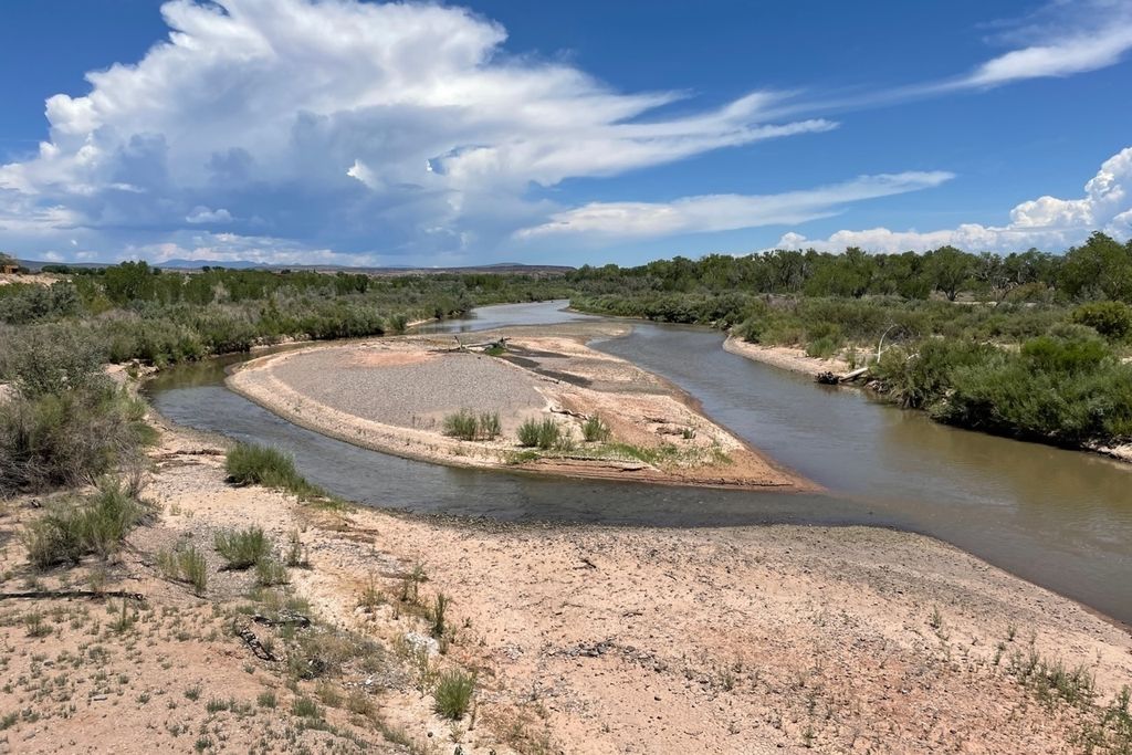 A river splits around a sand bar