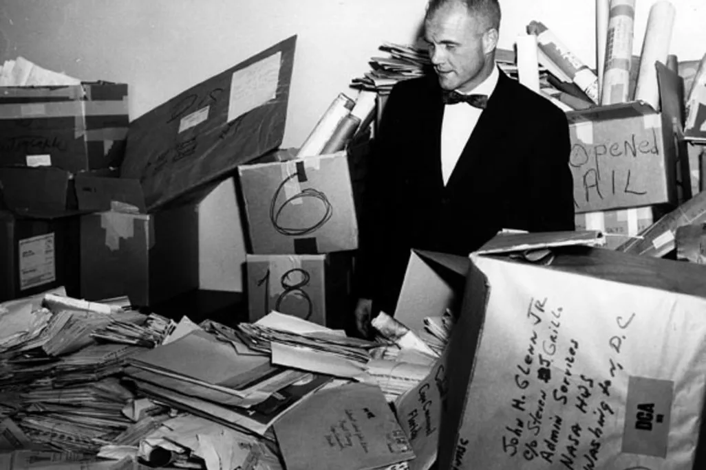John Glenn stands in the NASA mailroom