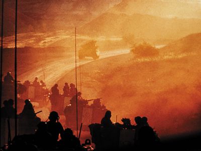 An Israeli armored brigade approaches the Golan Heights to relieve forces under Syrian attack on day two of the 1973 Arab-Israeli War. U.S. fears that the Soviet Union would send troops to assist Egypt and Syria sparked a DEFCON level increase.