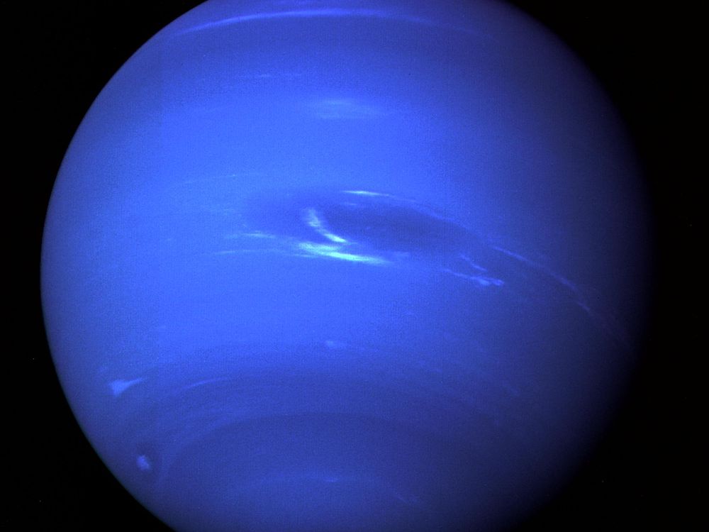 A photo of Neptune highlighting its deep blue color and Great Dark Spot in its center