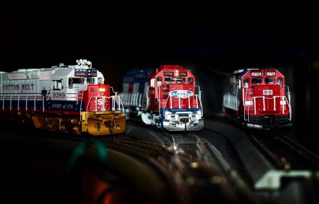 7 - Three model trains are photographed for an Independence Day celebration. The patriotic red, white and blue color scheme was popular in the mid 1970s in honor of the United States’ 200th birthday.