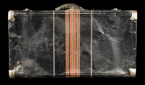 This black metal suitcase belonged to Iku Tsuchiya. It went with her to Tanforan Assembly Center, then to the Topaz camp, and back home to San Leandro, California. (NMAH)